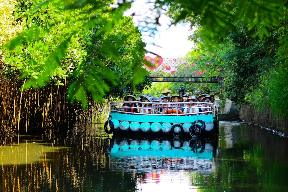 blue boat near tree