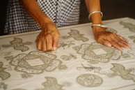 person holding textile