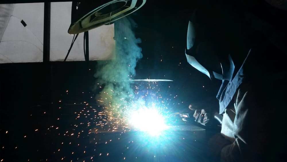 a welder working on a piece of metal