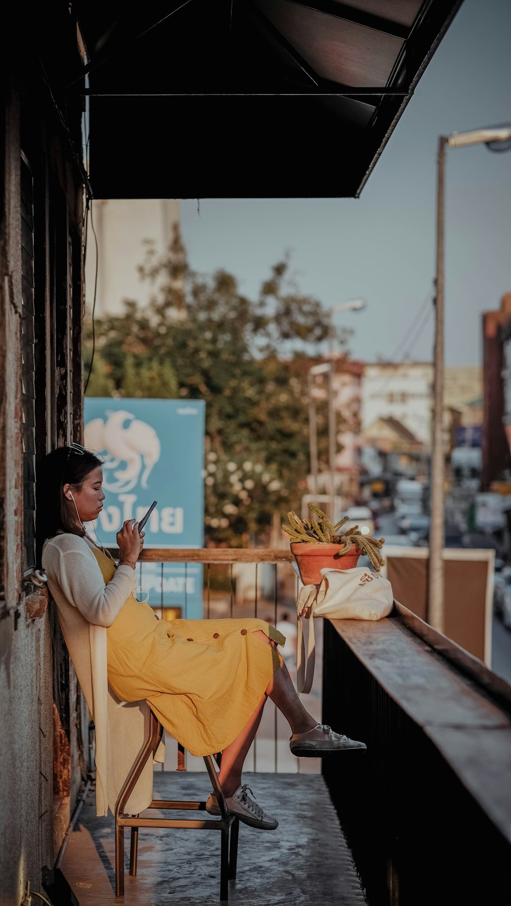 woman sitting on brown chair