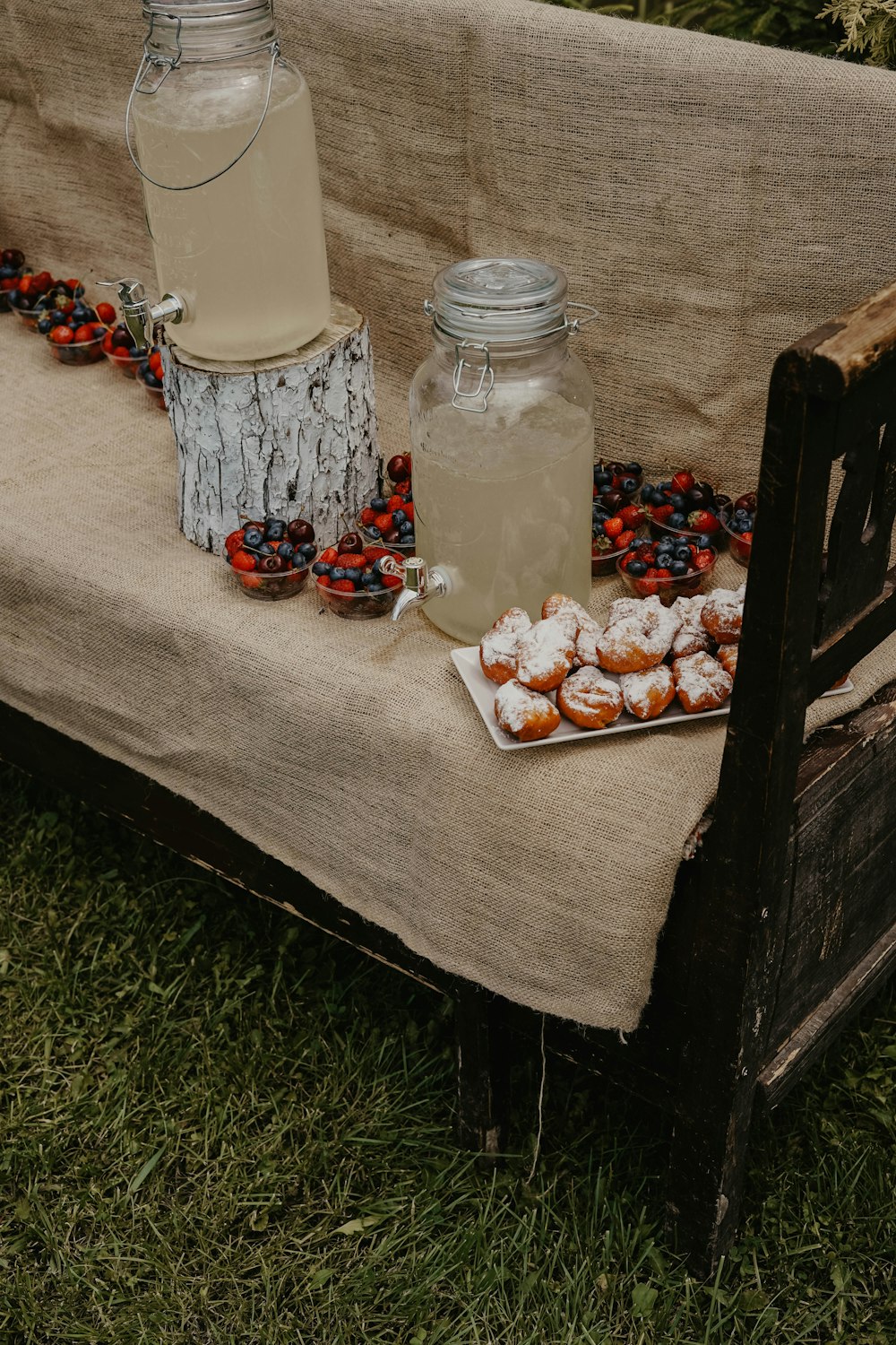 desserts and drink on a bench