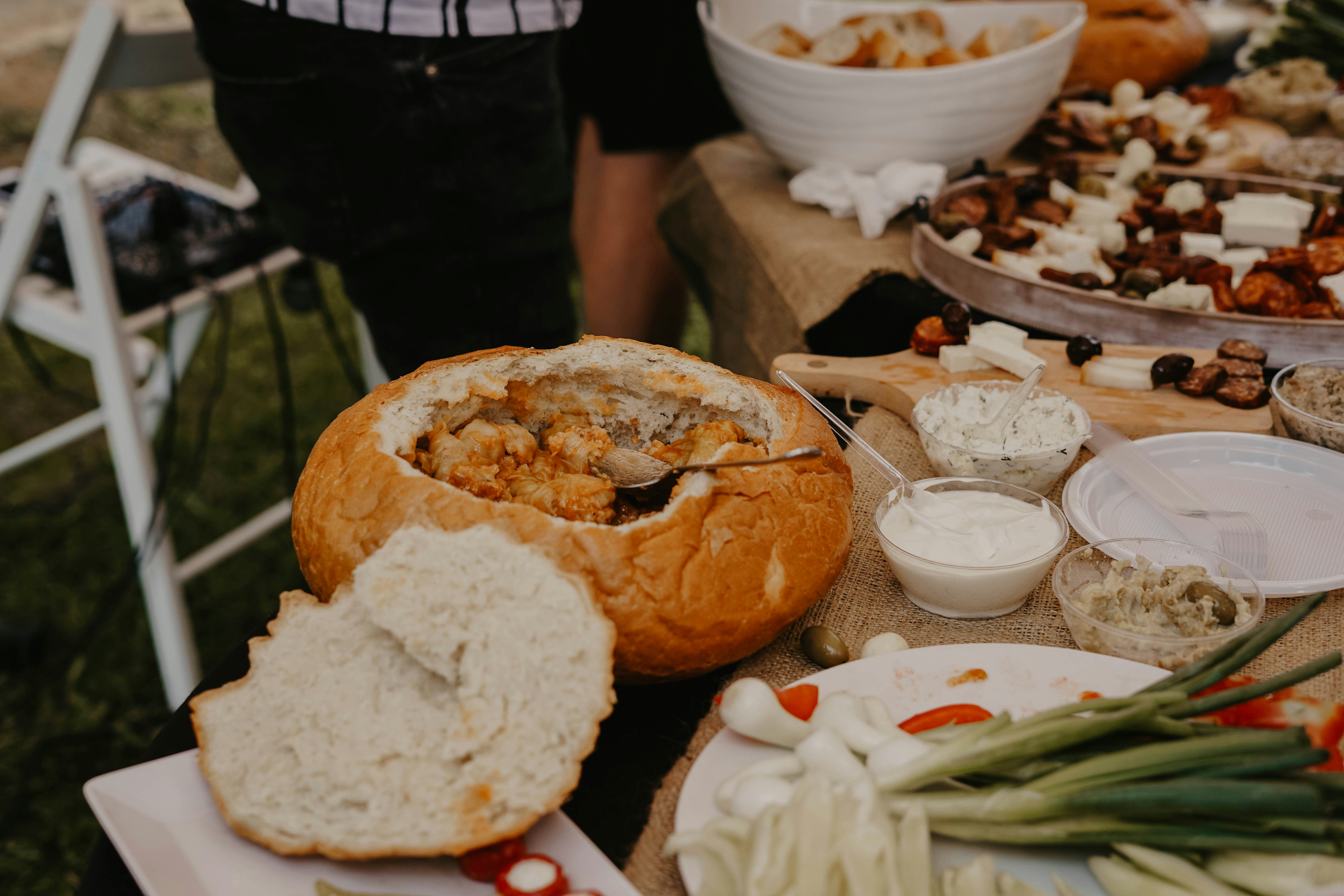 A generous sharing buffet with breads, dips, vegetables and savoury bites