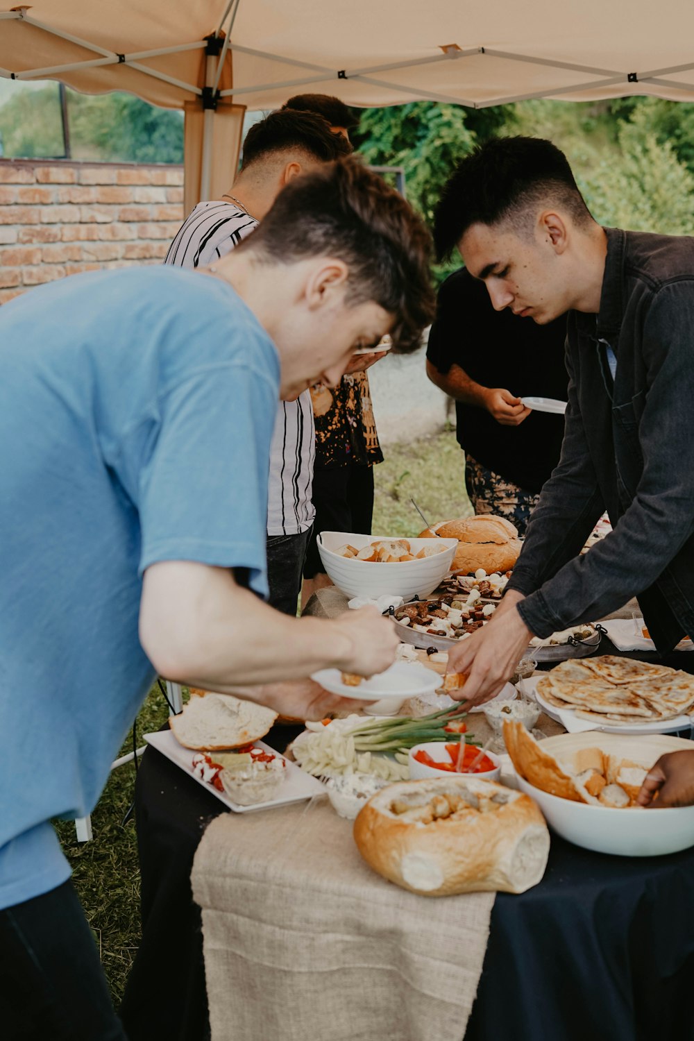 two men grabbing food