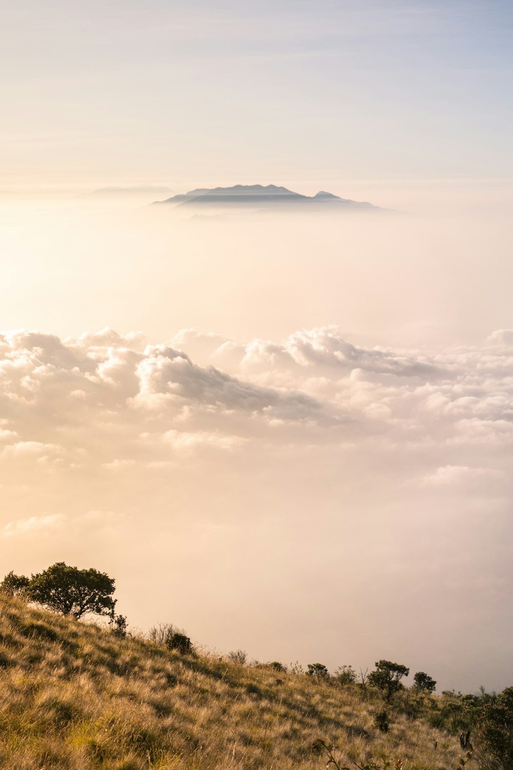 landscape photo of mountain under cloudy sky during daytime