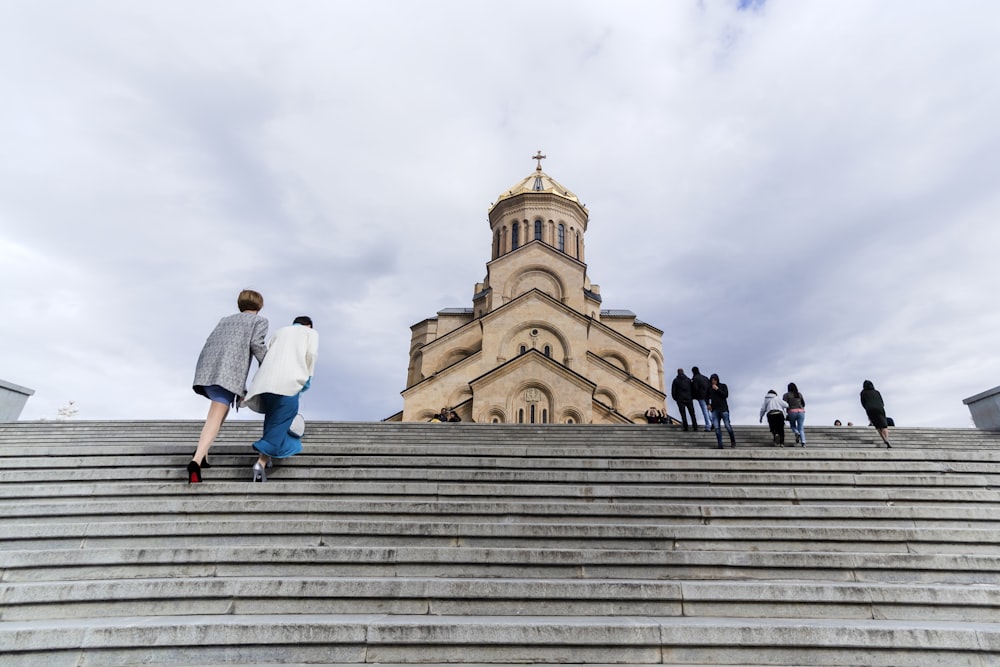 people walking near church