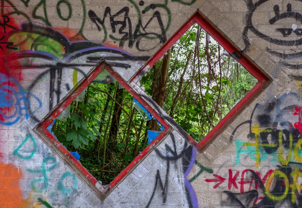 two square red-framed mirrors