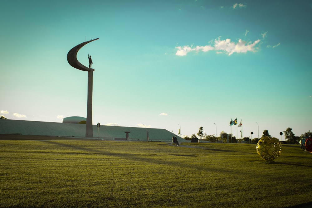 grass field and white building