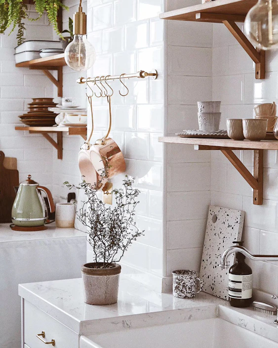 A cozy kitchen scene featuring a soft anti-fatigue mat in front of a stove with warm lighting