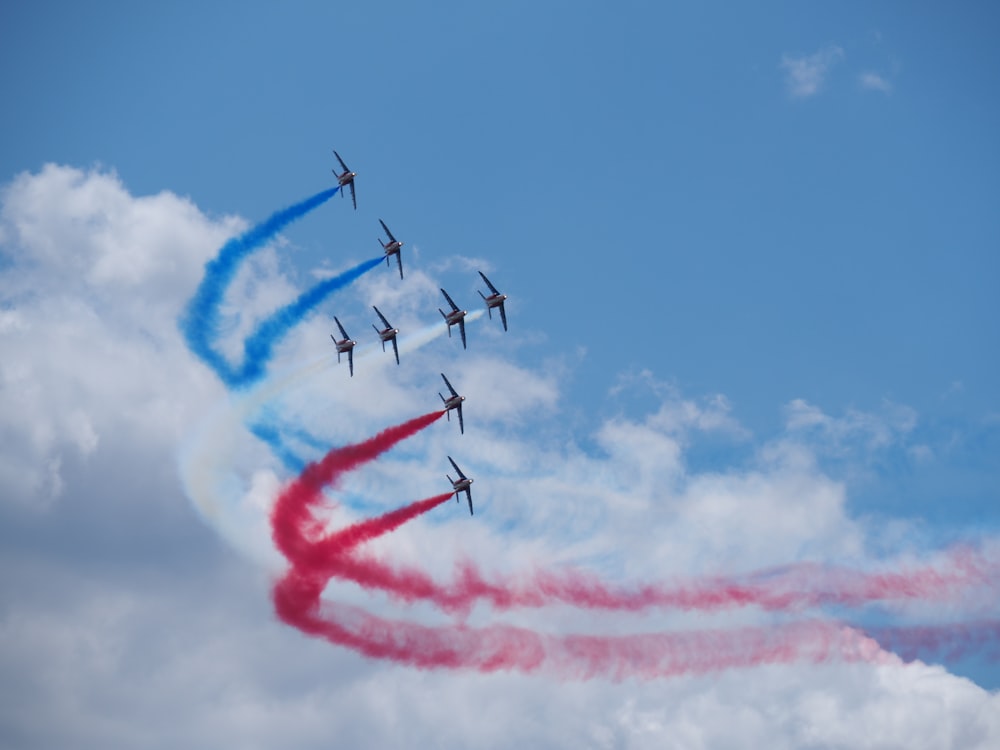 eight jetplanes with smoke tracks