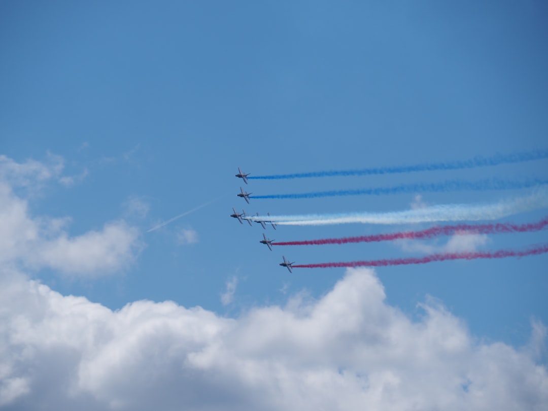 photography of five air planes during flight