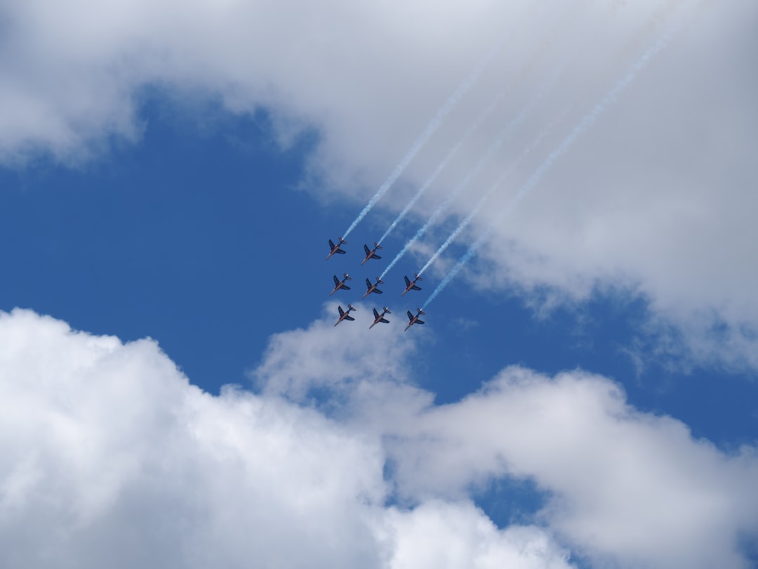seven jetplanes with smoke tracks,