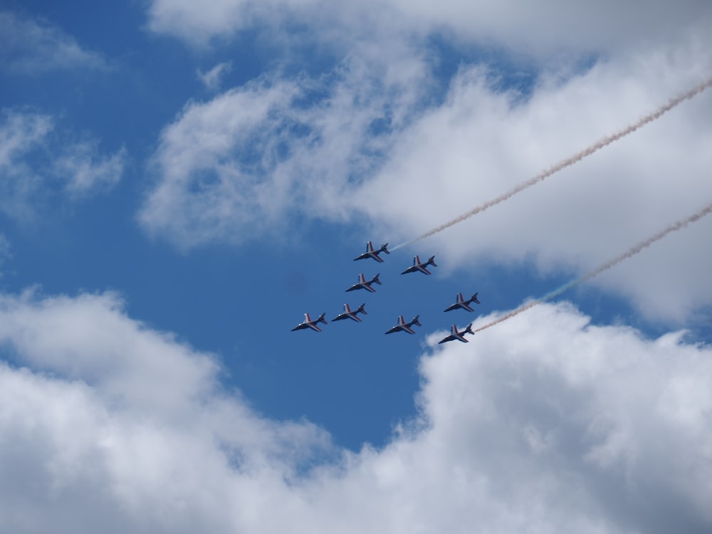 seven airplanes during daytime