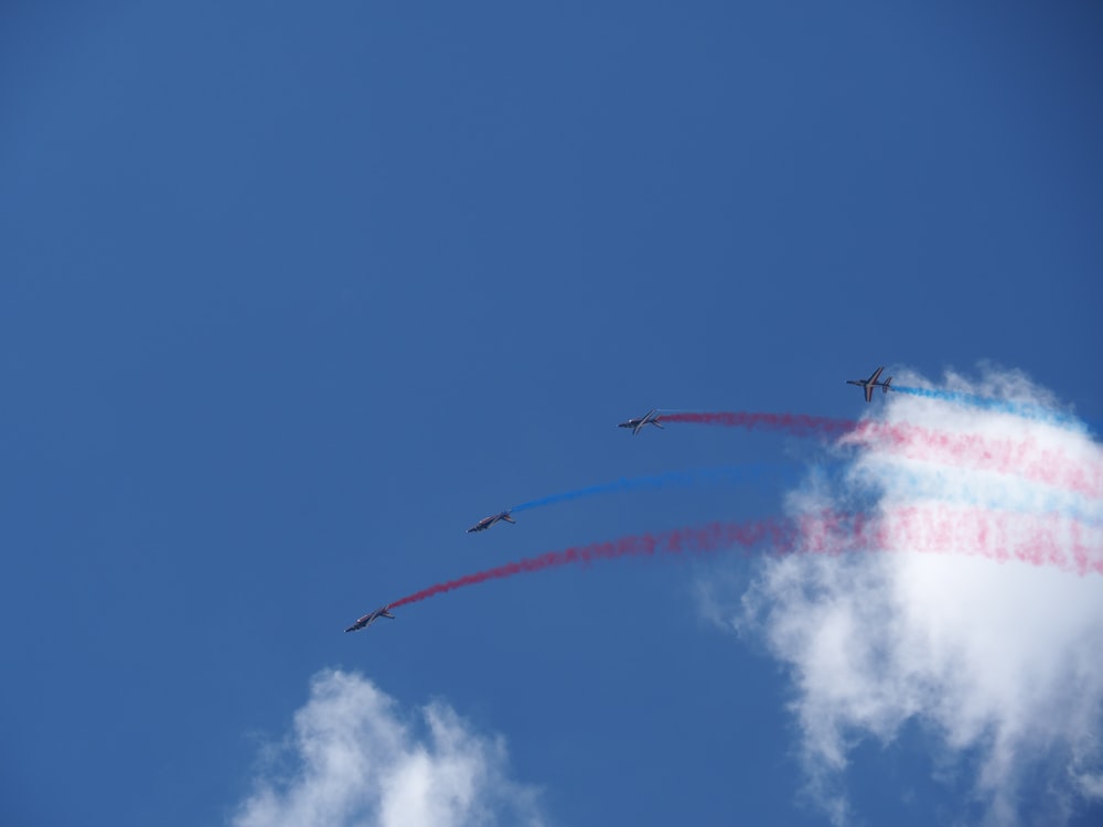 view of four aircraft during airshow at daytime