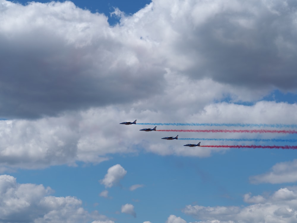 photography of four air plane during flight