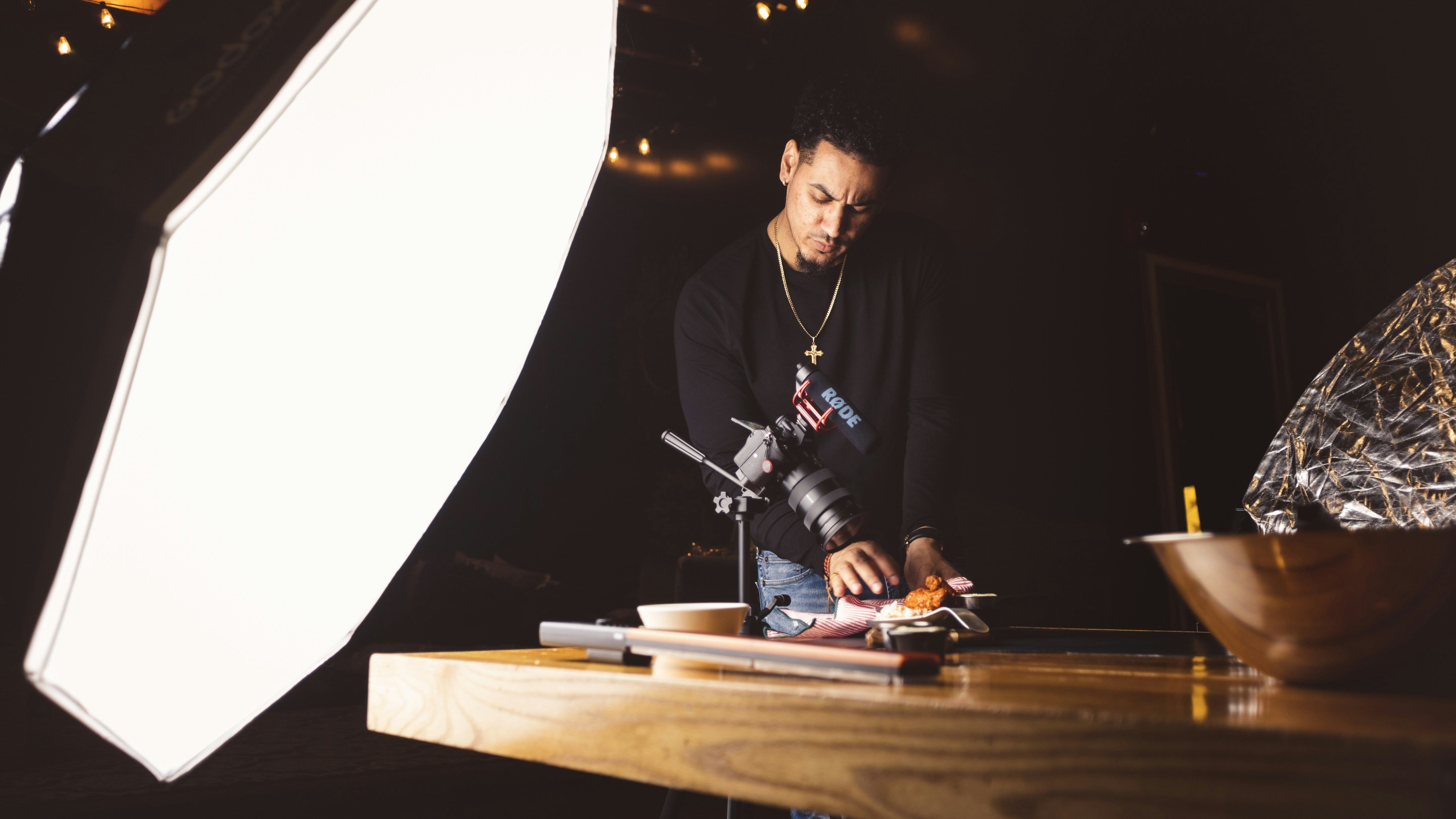 man standing beside table