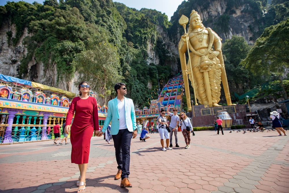 people gathered near Hindu Deity statue