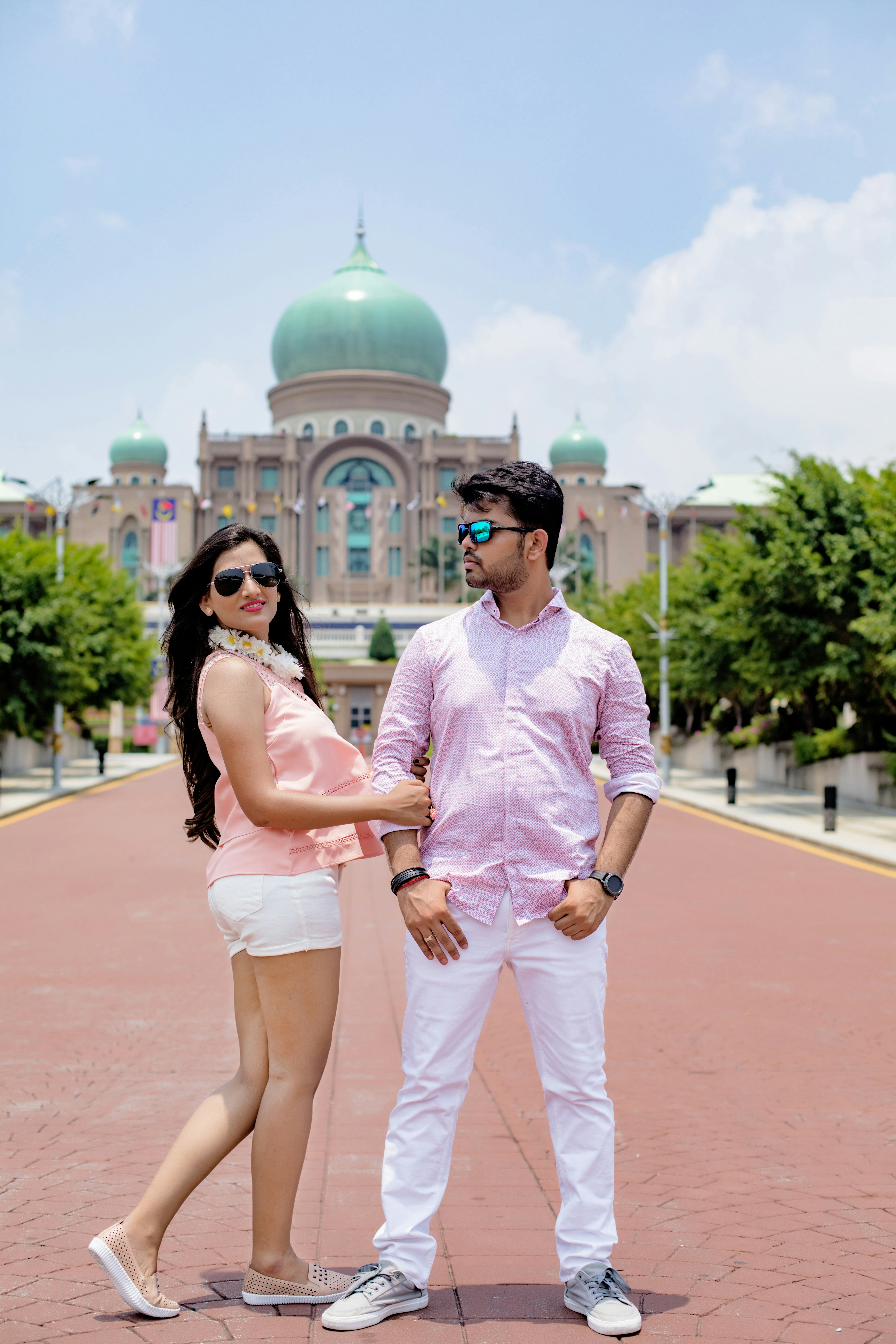 man and woman standing near building