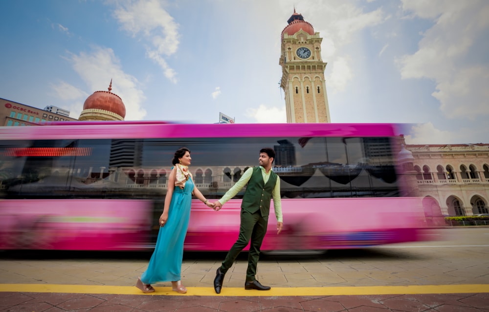 man and woman walking on road