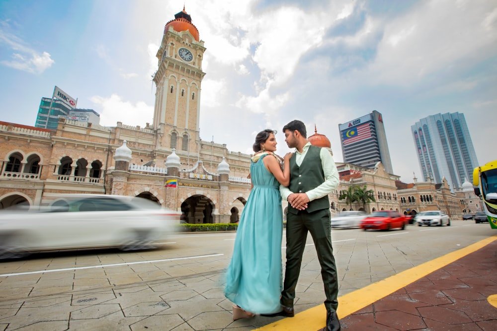 man and woman standing in front of church