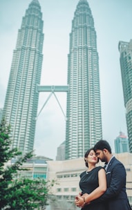 A happy family standing in front of an iconic global city skyline, symbolizing new beginnings.