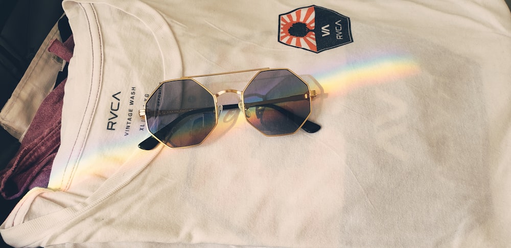 gold-framed sunglasses