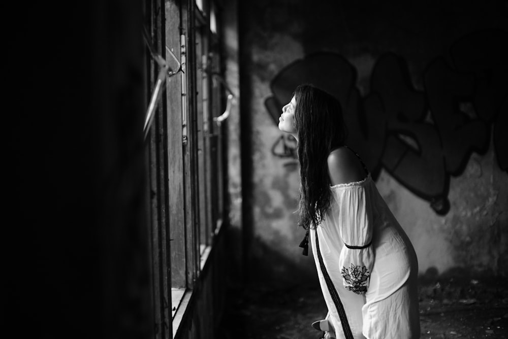 woman leaning forward on window