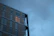A sleek, modern commercial building facade illuminated at dusk, showcasing architectural elegance.