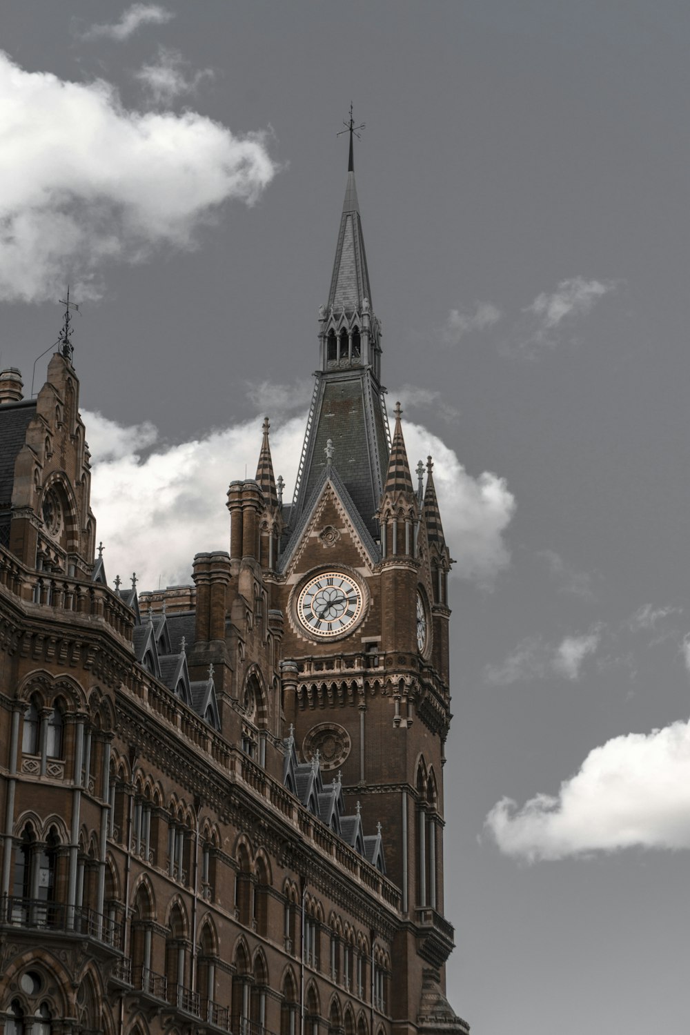 brown concrete clock tower during daytime