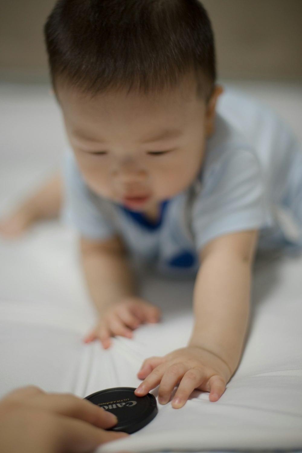 toddler in blue shirt