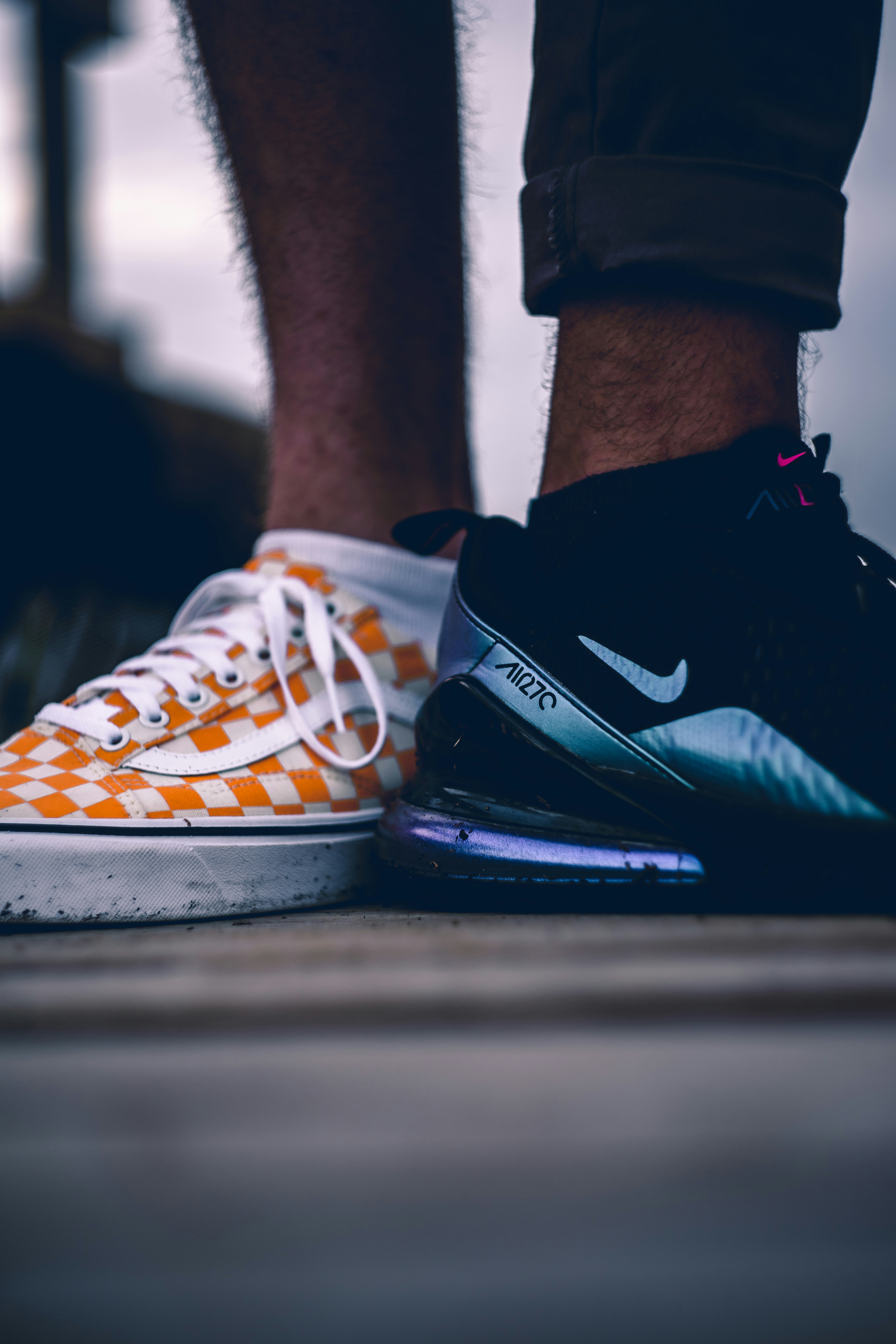 a close up of a person's feet wearing sneakers