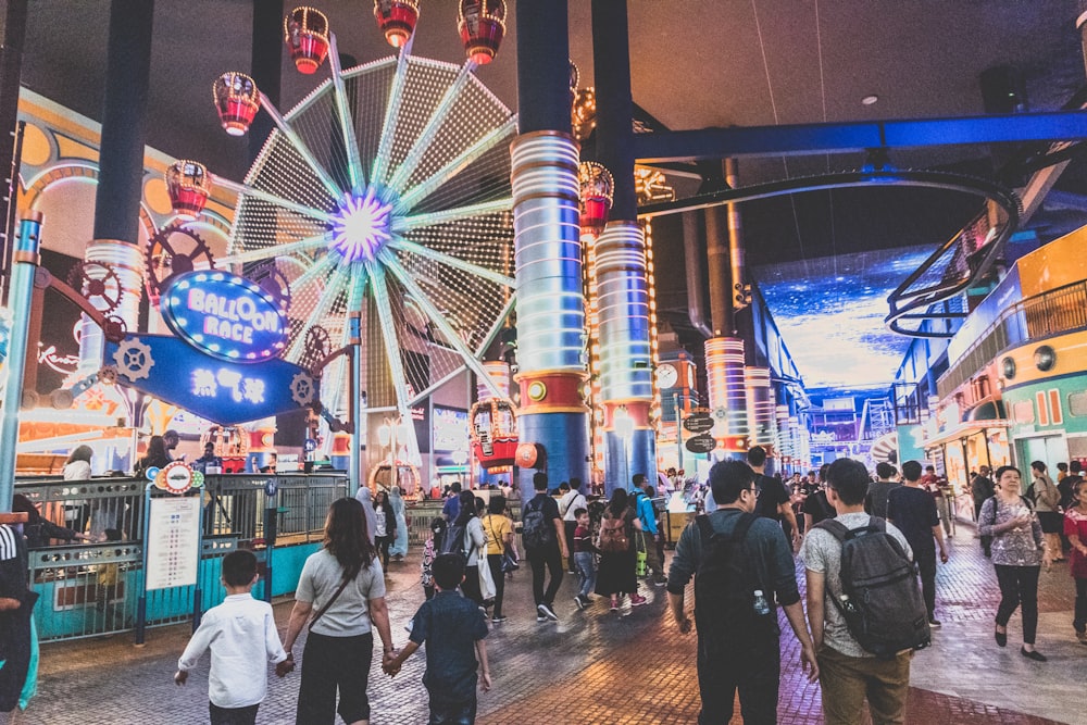 people walking near carnival ride