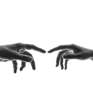 two person's connecting fingers