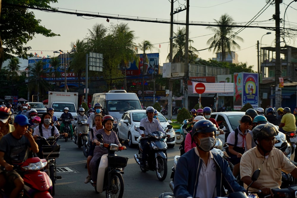 people riding vehicles during daytime