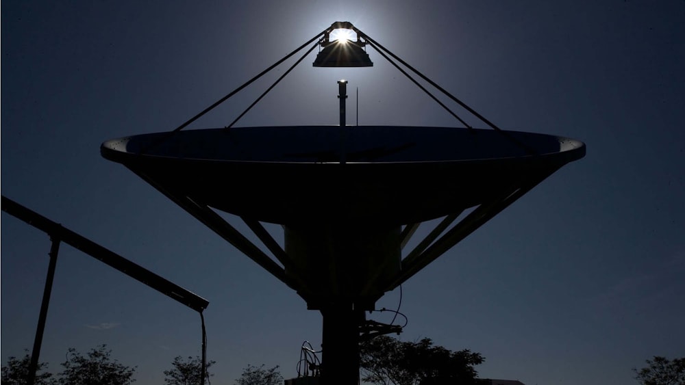 silhouette photography of satellite dish