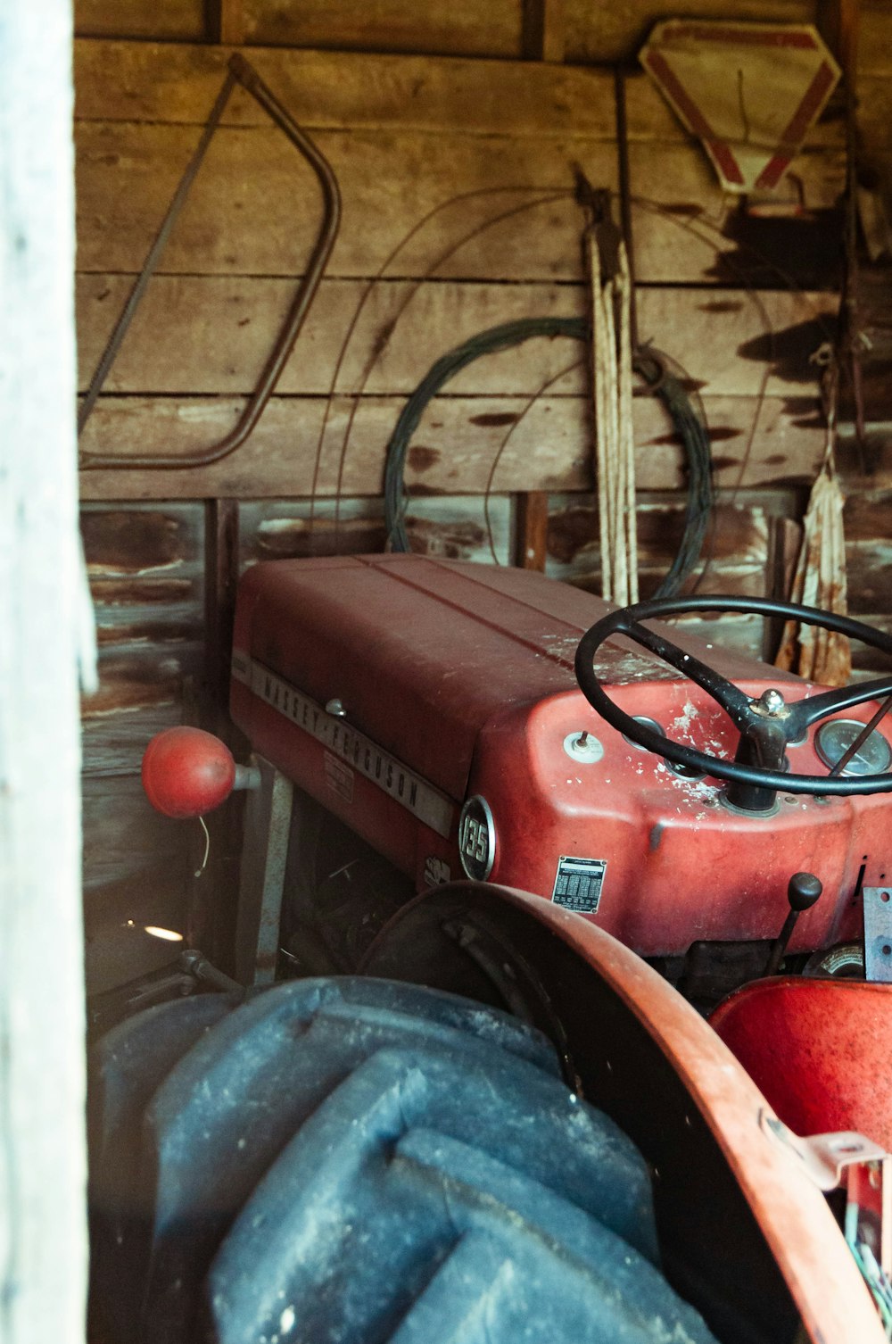 red and black tractor in building