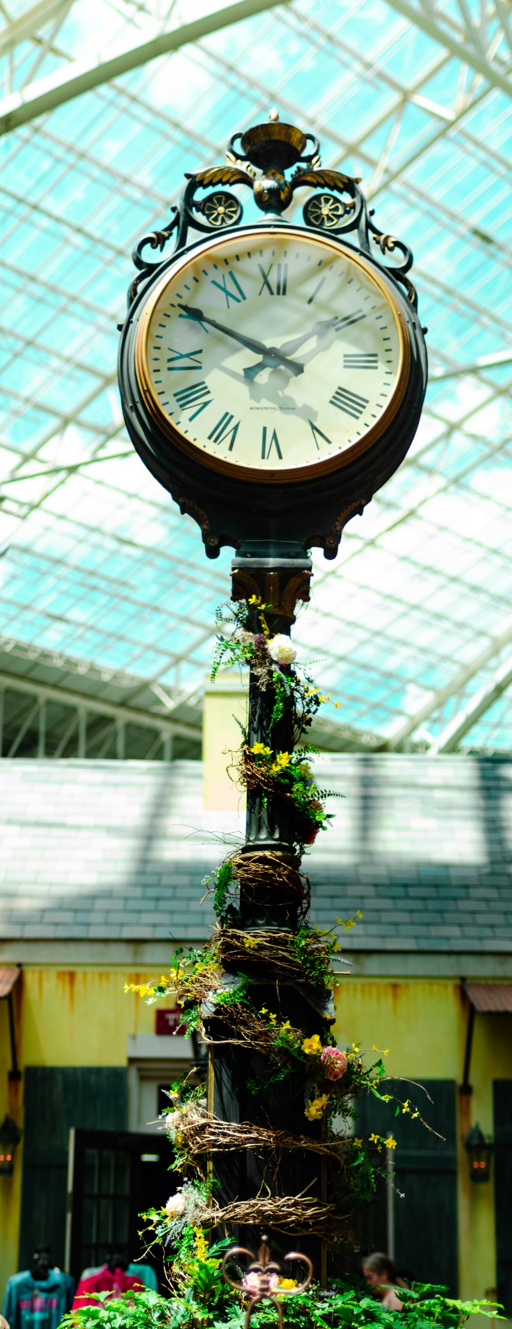 round black framed analog clock