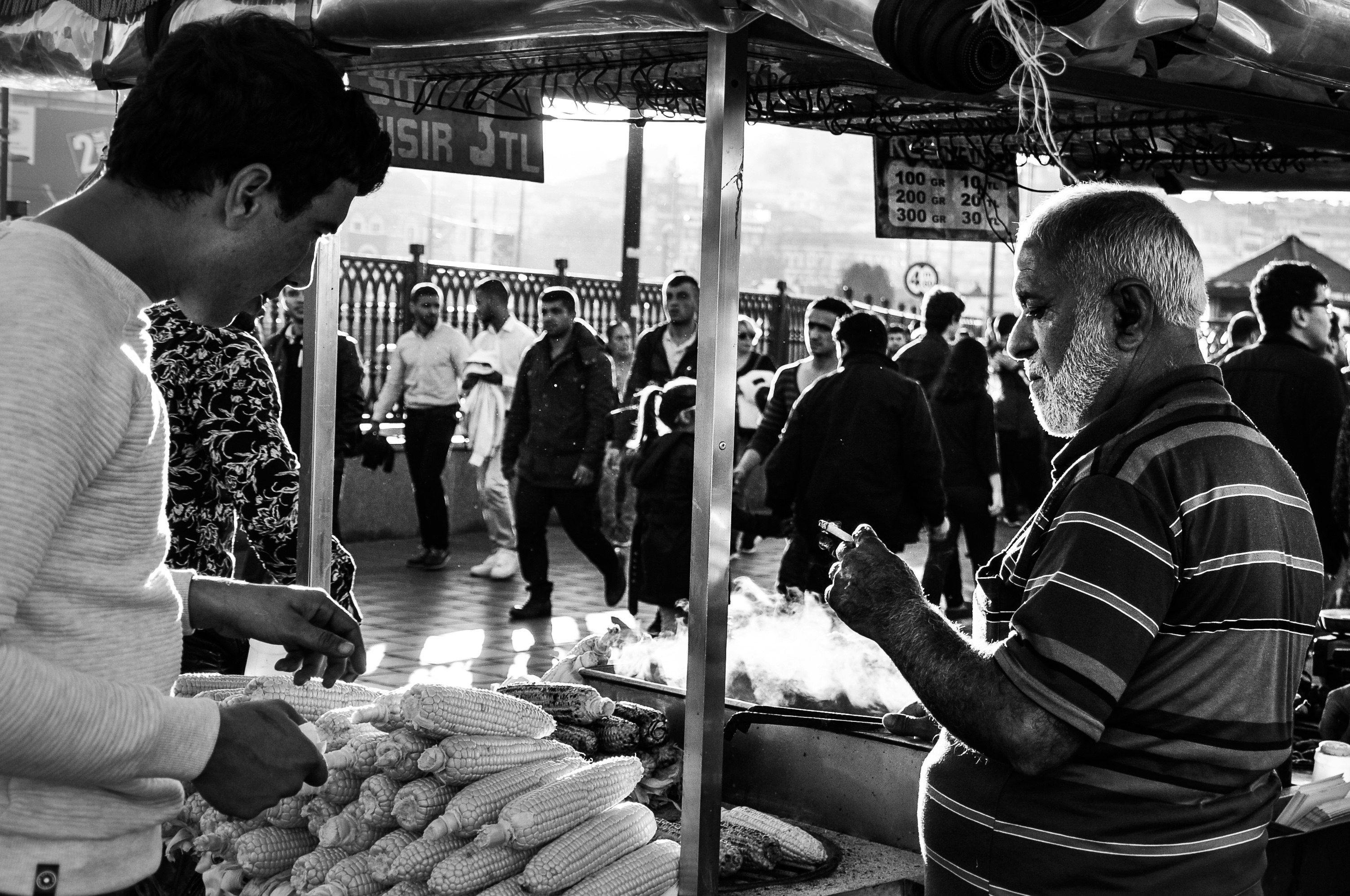 people looking at vegetable on display