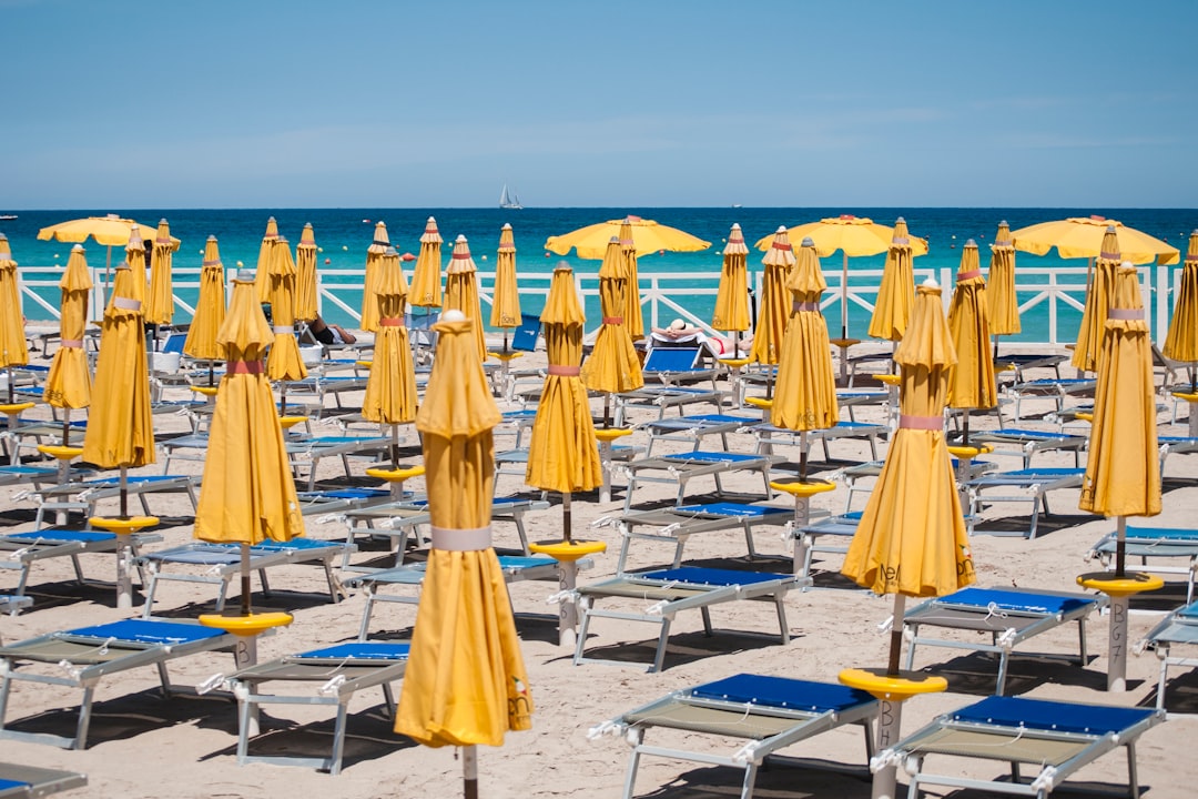 yellow umbrellas near seashore
