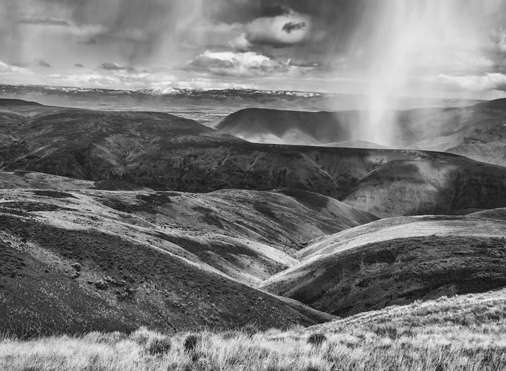 greyscale photo of hill