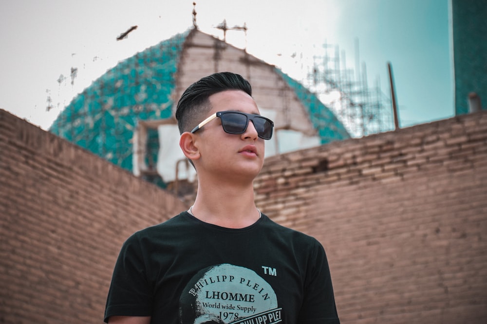 man standing near building during daytime