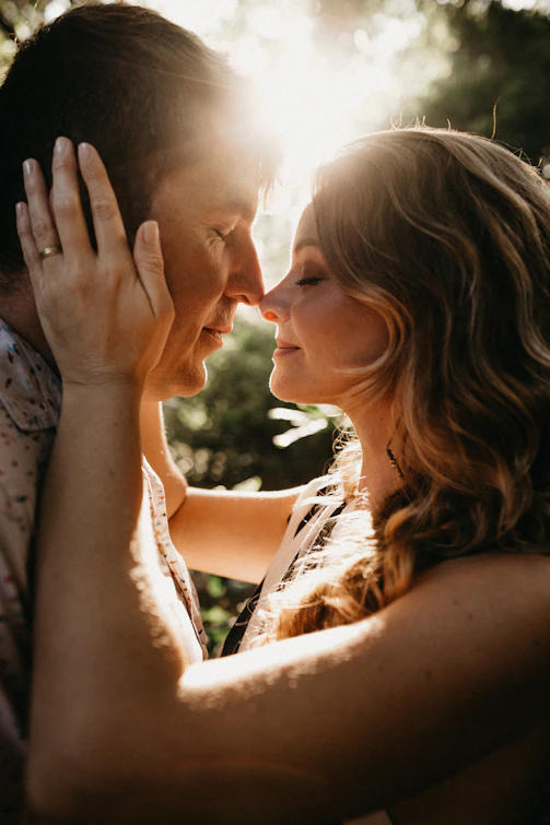 woman holding man's face