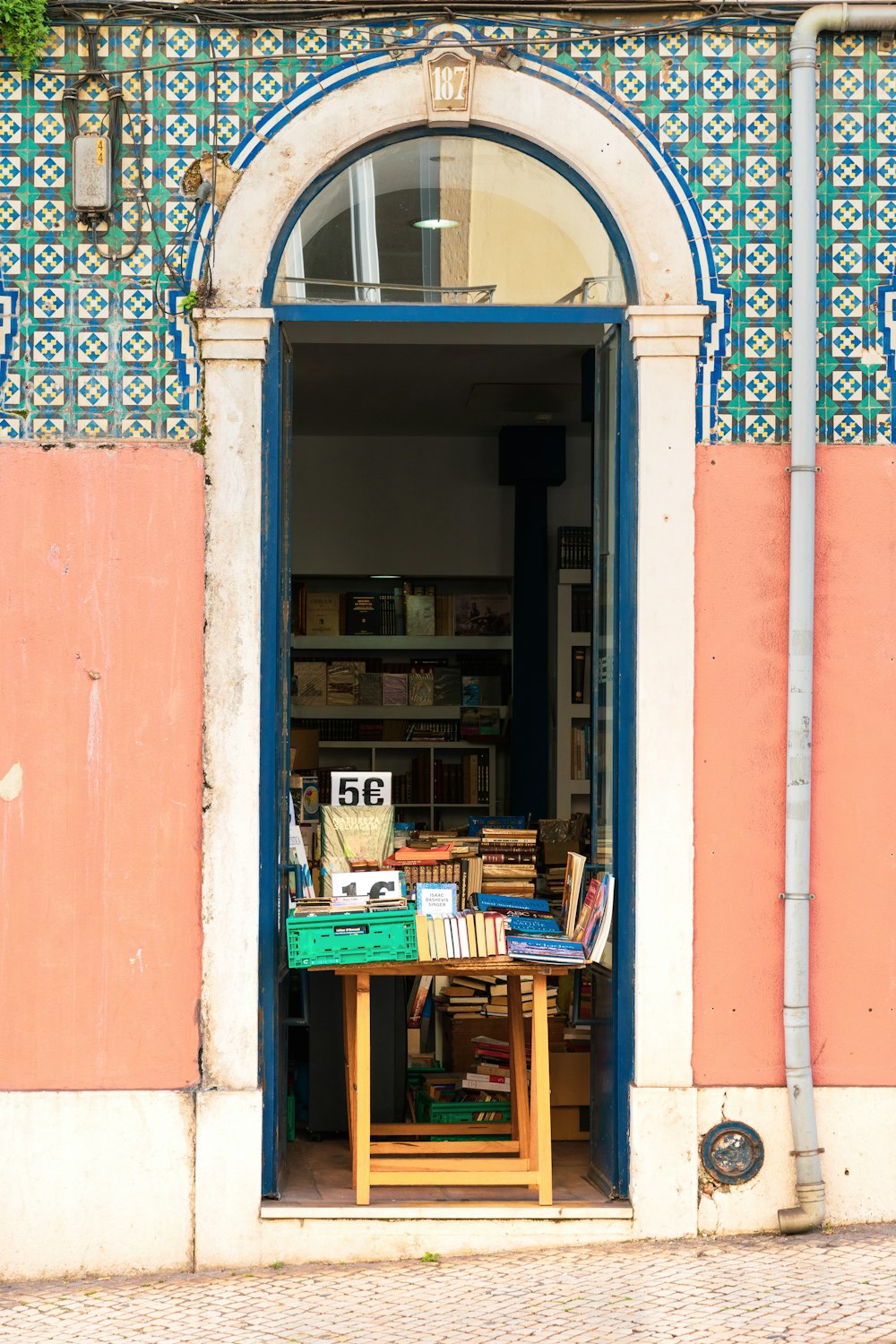 brown wooden table full of products near doorway