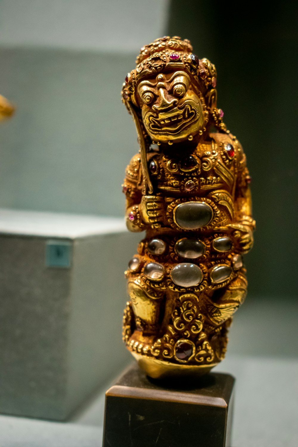 gemstone encrusted gold figurine