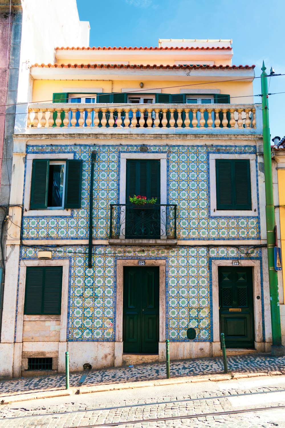 blue and brown concrete 2-story house