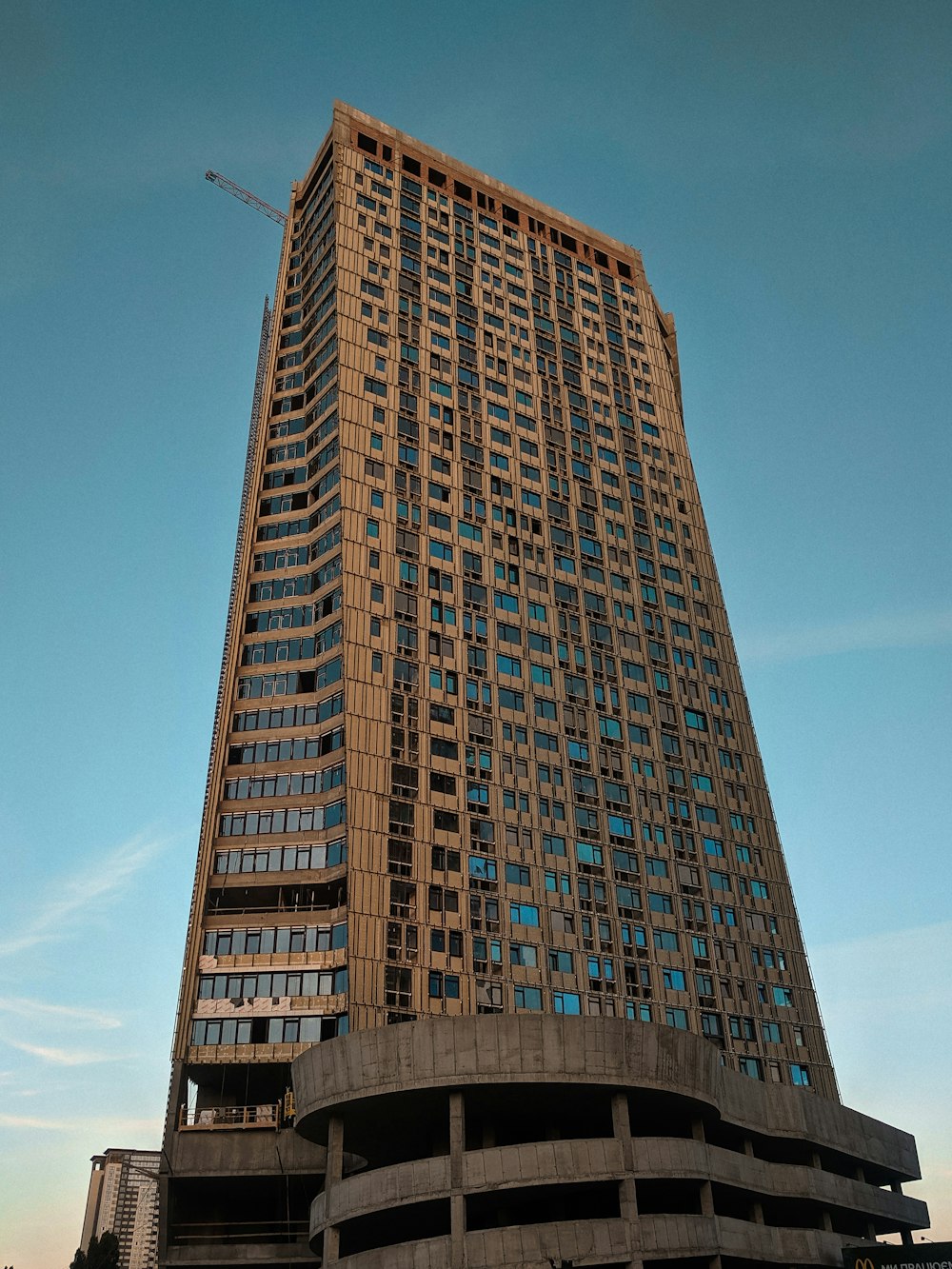 brown high-rise building under blue sky