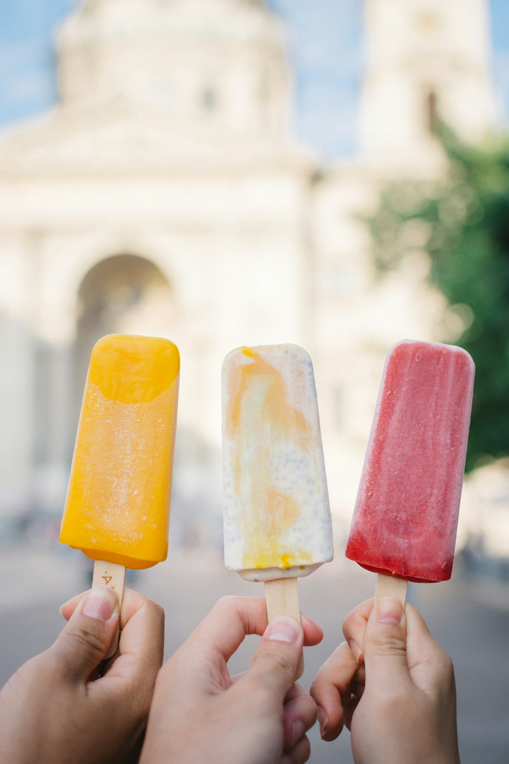 three assorted popsicle sticks