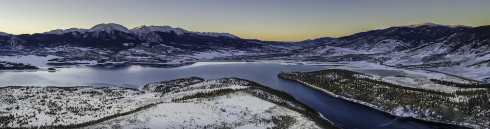 body of water between plain fields