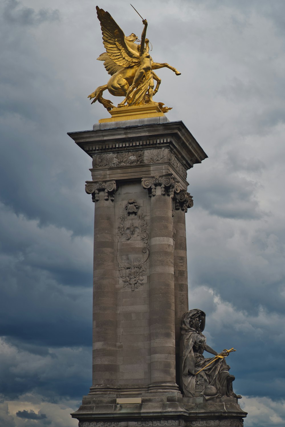 man riding winged horse statue