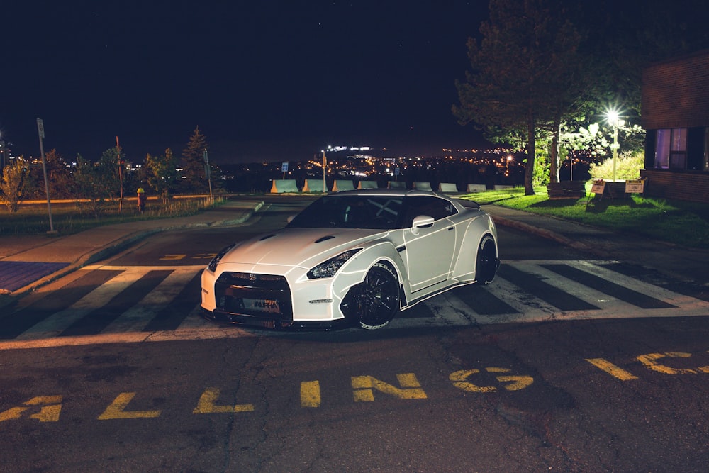 white coupe on street