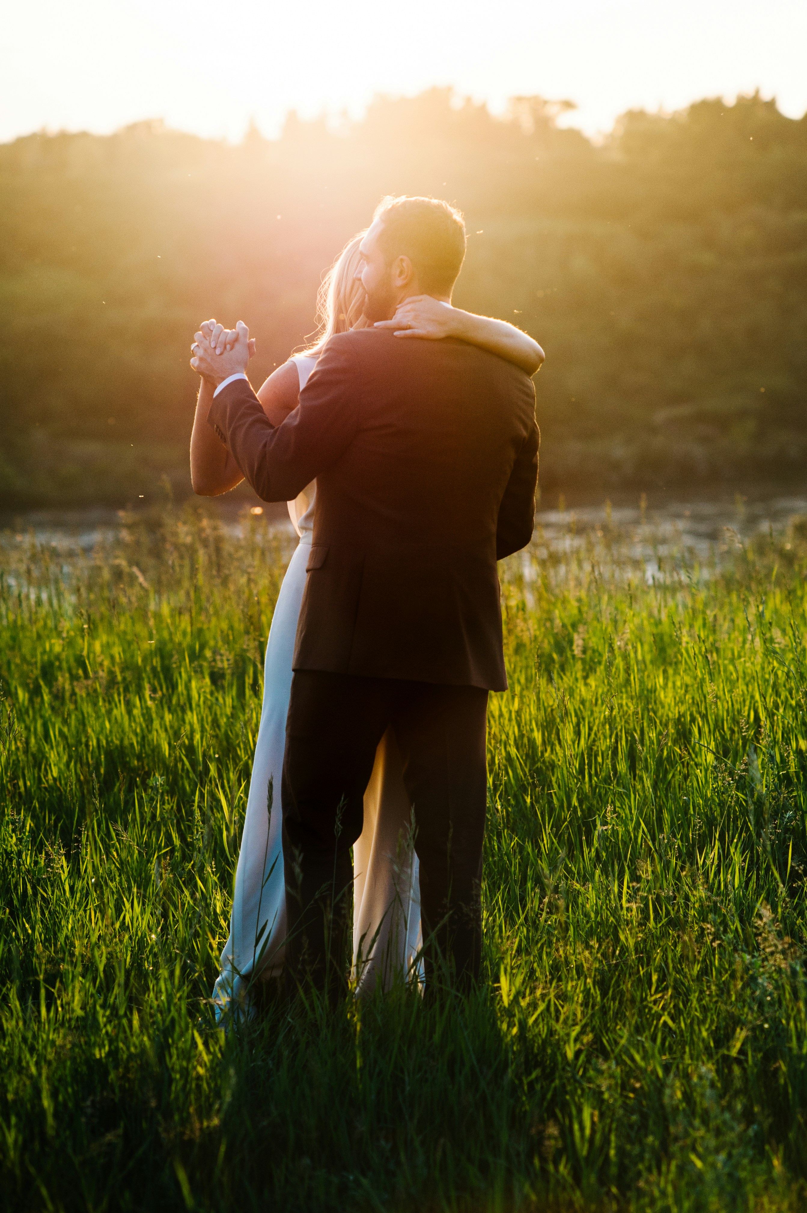 man and woman dancing on green grass field